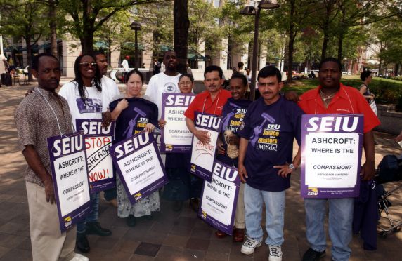 (29800) Demonstrators Hold Signs and Shirts, Immigration Rights Rally, Washington, D.C., 2002 (29800) Demonstrators Hold Signs and Shirts, Immigration Rights Rally, Washington, D.C., 2002